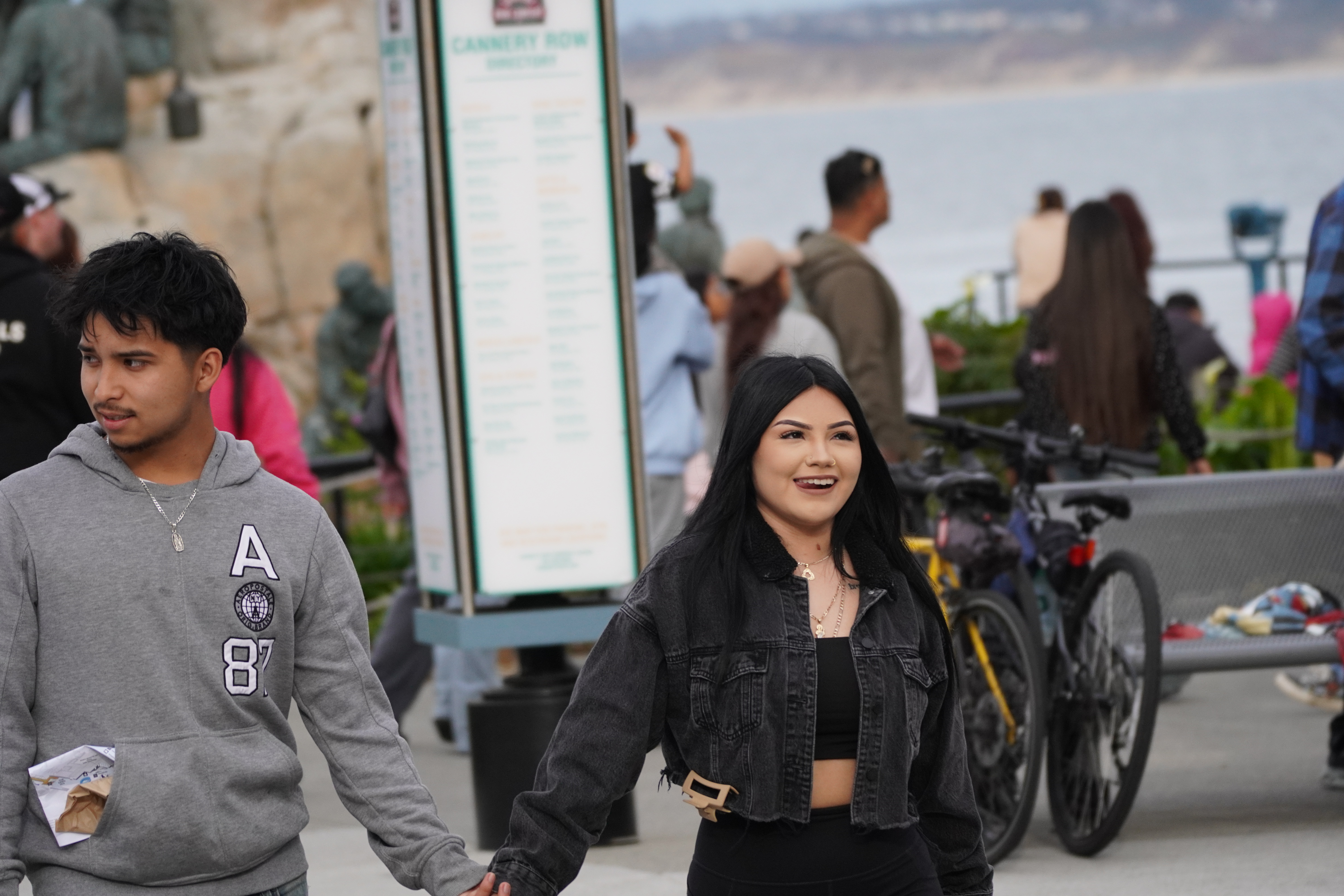 Portrait of two people walking together near the waterfront