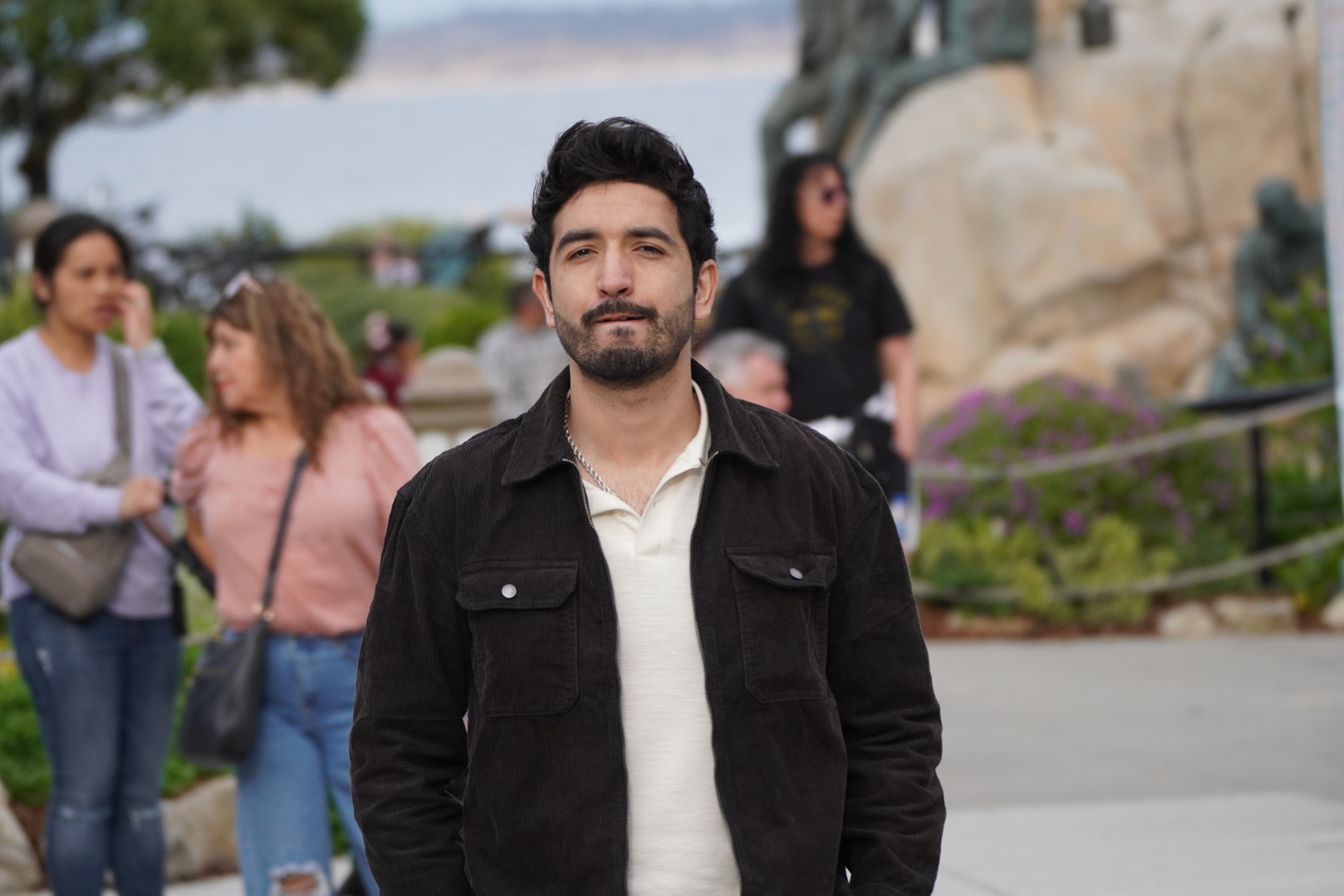 Portrait of a man walking toward the camera outdoors